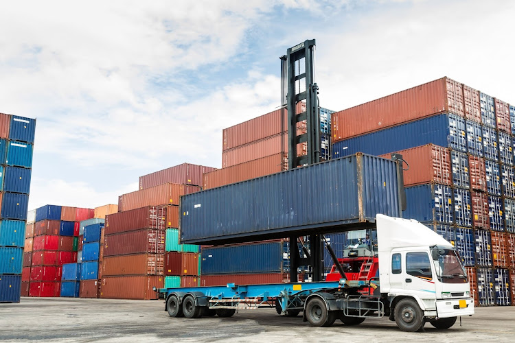 20881868 crane lifting up container in yard